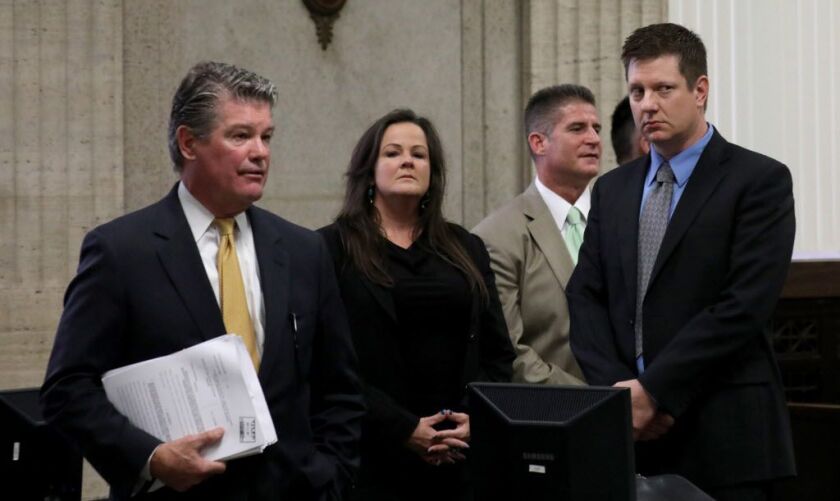 Randy Rueckert, from left, Tammy Wendt and Daniel Herbert with their client Jason Van Dyke at the start of the hearing. The defense attorneys for Jason Van Dyke unsuccessfully argued that first degree murder charges should be dropped against their client