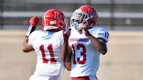 Kenwood’s Kahlil Tate (11) and Oamrion Lewis (13) celebrate Tate’s touchdown against Simeon last season.