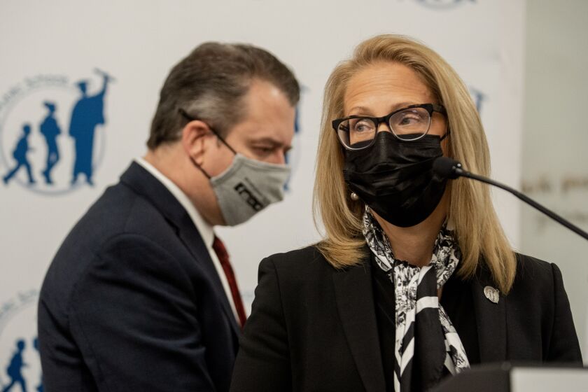 Chicago Public Schools CEO Pedro Martinez walks behind Title IX Director Camie Pratt during a press conference at the Chicago Public Schools headquarters in the Loop, Friday morning, Nov. 19, 2021, where officials discussed multiple sexual harassment and grooming cases at Marine Leadership Academy that are undergoing investigation.