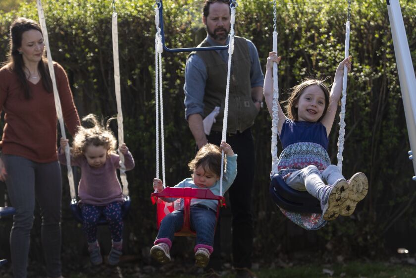 The Anderes family enjoys time together swining on the swing set, Thursday, April 30, 2020.
