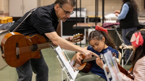 Juan Díes, co-founder of the Sones de Mexico Ensemble, teaches guitar at the Arturo Velasquez Westside Technical Institute, Saturday, March 21, 2026.