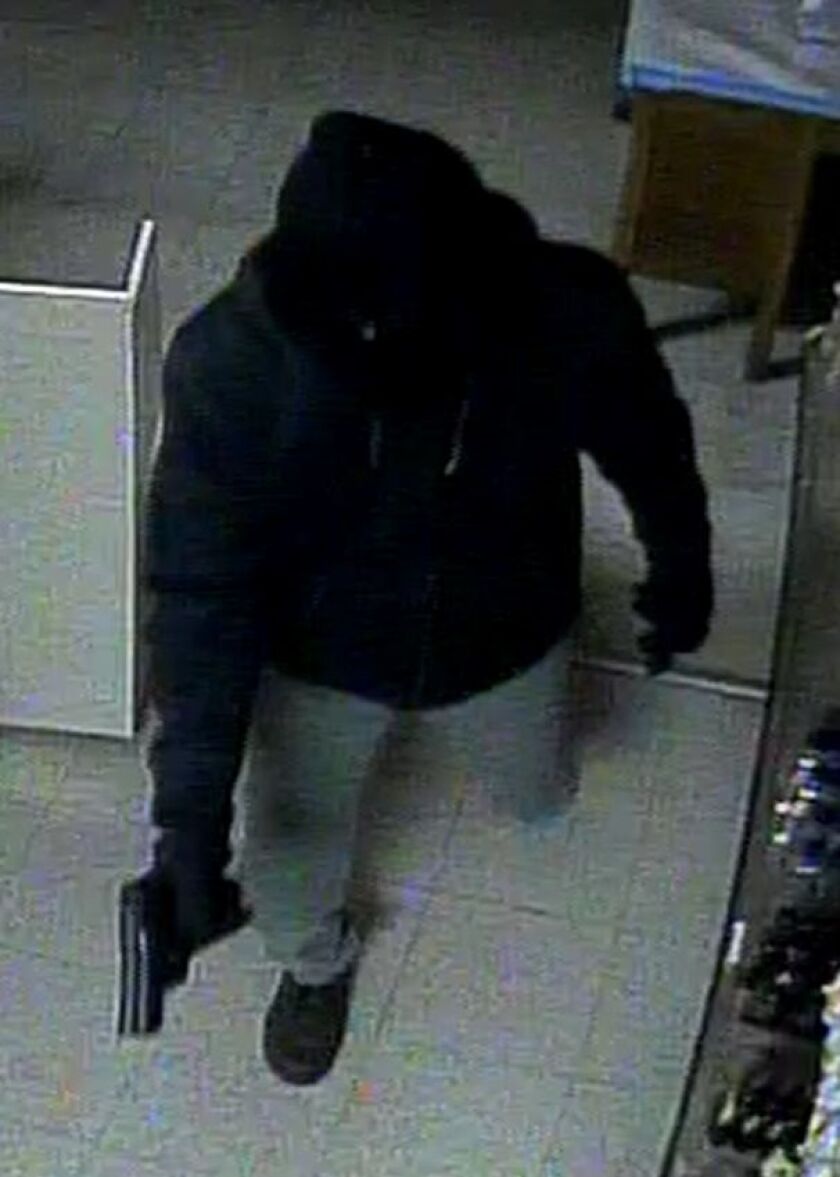 Surveillance image of the suspect in an armed robbery Feb. 26 at One Stop Liquors, 1401 Prairie St. in St. Charles. | St. Charles police