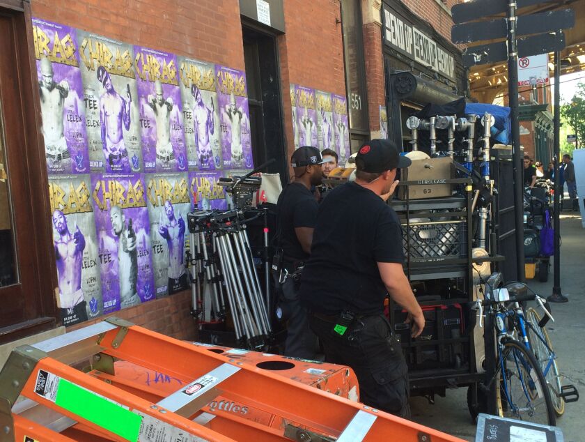 <small><strong>Members of the crew manage equipment on Spike Lee’s “Chiraq.” | Stefano Esposito/ Sun-Times</strong></small>