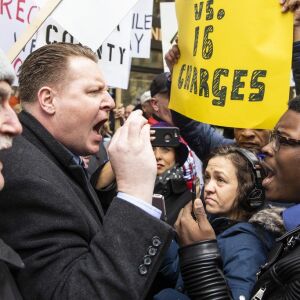 Former mayoral candidate and community activist Ja’Mal Green spars with Fraternal Order of Police supporters who protested against Cook County State’s Attorney Kim Foxx outside the county administration building, Monday, April 1, 2019. | Ashl