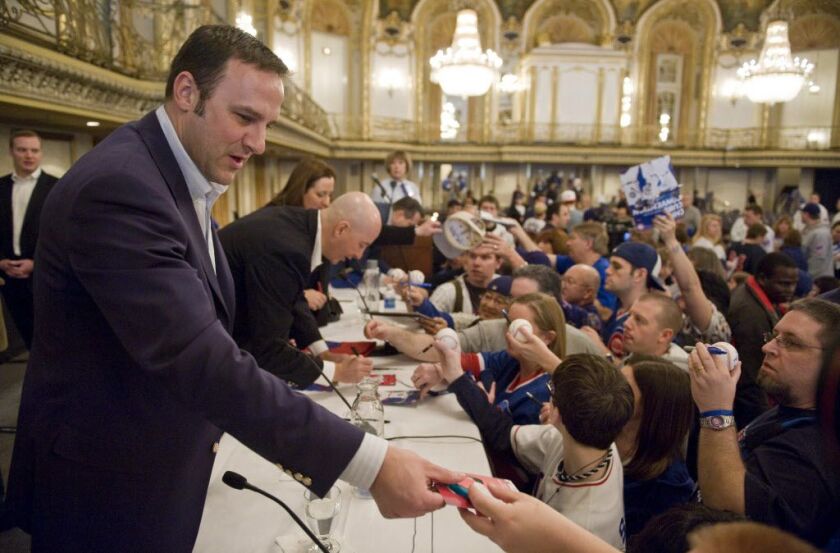 (From left) Todd Ricketts, Pete Ricketts and Laura Ricketts signing autographs at the Cub’s Convention in January 2011. | Rich Hein~Sun-Times file photo