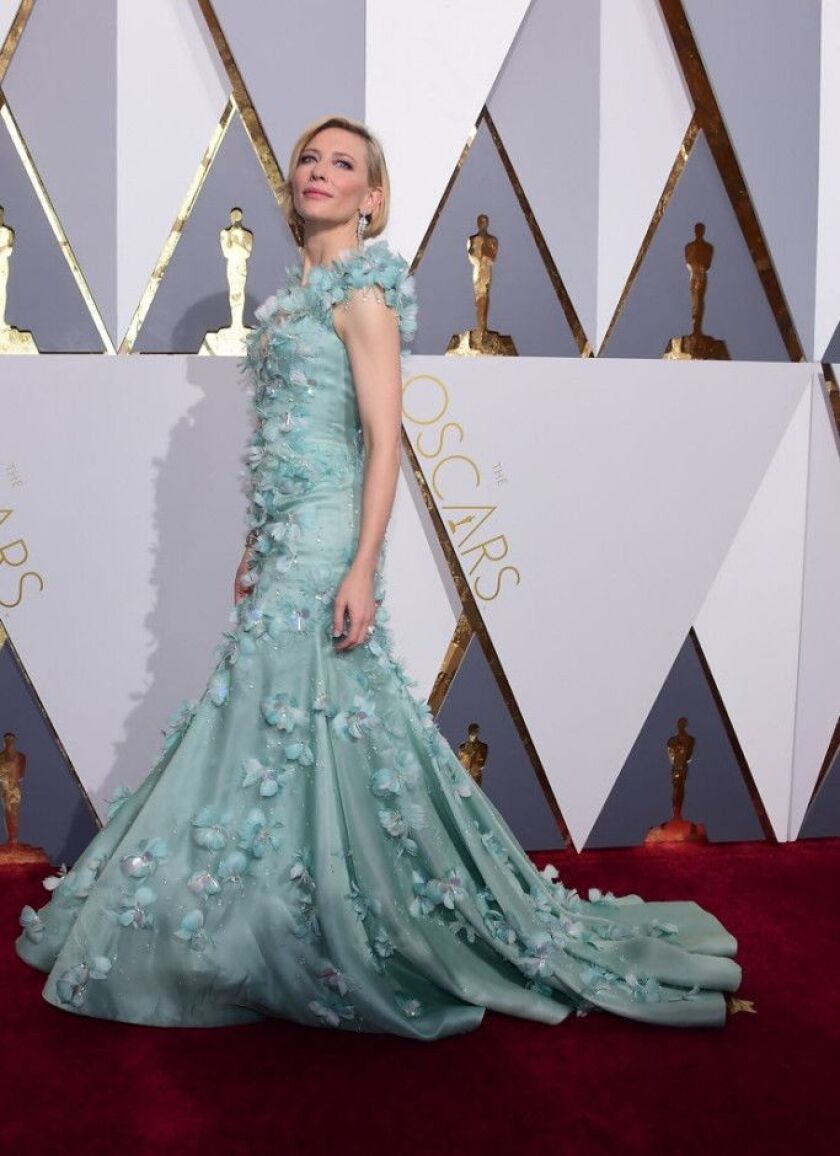 Cate Blanchette wears a seafoam green Armani Prive gown bedazzled with Swarovski crystals. | AFP PHOTO / FREDERIC J. BROWNFREDERIC J.BROWN/AFP/Getty Images