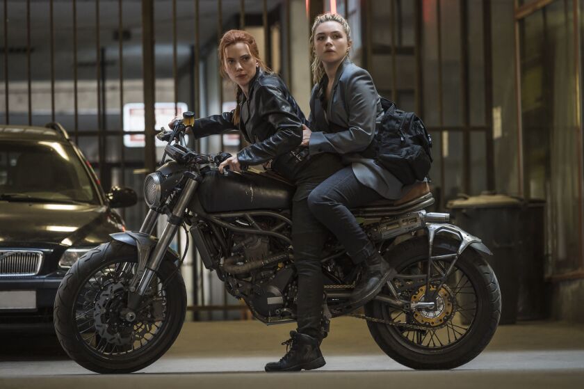 This image released by Marvel Studios shows Scarlett Johansson, left, and Florence Pugh in a scene from “Black Widow.”
