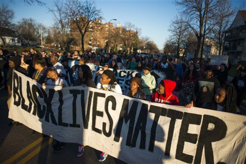 Protesters march down Plymouth Ave. N to the Minneapolis 4th Precinct on Sunday. | Mark Vancleave/Star Tribune via AP