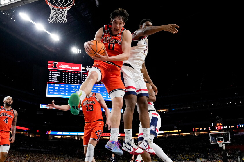 Illinois forward David Mirkovic (0) rebounds over UConn forward Tarris Reed Jr. during the first half of a Final Four game on April 4, 2026, in Indianapolis.