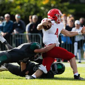 Glenbard West’s defense takes down Hinsdale Central’s Michael Brescia (4).