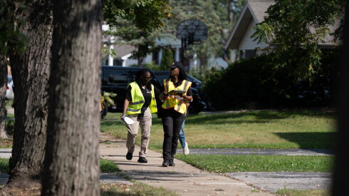 Local, state and federal officials wearing safety vests go door-to-door in the 1900 block of Jodi Terrace in Homewood, Ill. to assess storm damage, Wednesday, Sept. 2, 2026.