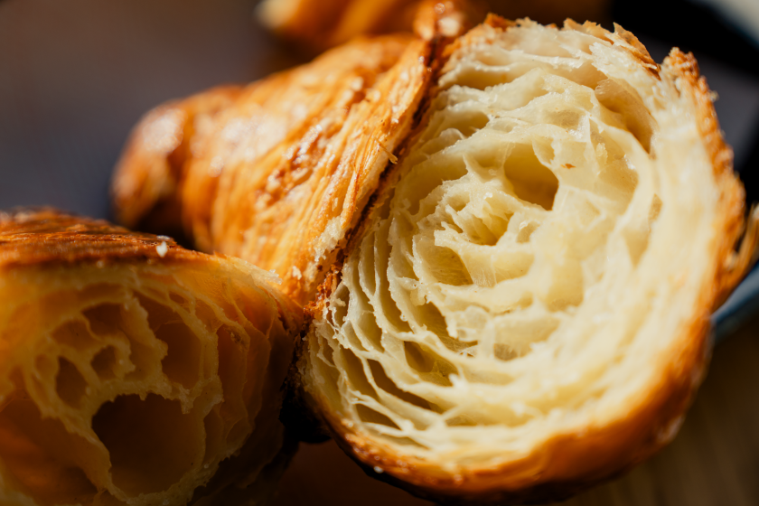 Our fondness for croissants lately tends toward the maximalist versions. But what makes for a truly great, flaky croissant? Here, a plain croissant is for sale at Floriole in Lincoln Park.