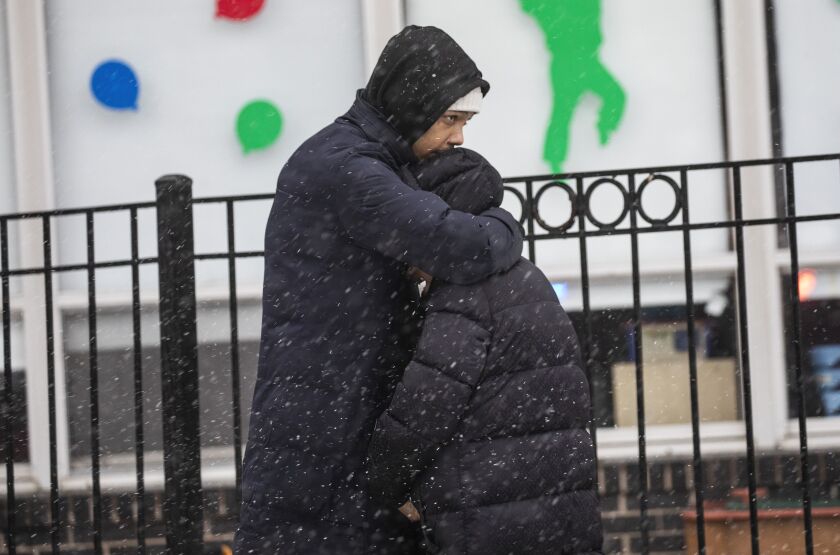 Residents, neighbors and supporters mourn after one person died and others were injured when a fire broke out in an apartment on the 15th floor and climbed nine floors in a high-rise building in the 4800 block of South Lake Park Avenue in Kenwood on the South Side, Wednesday, Jan. 25, 2023.