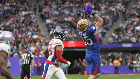 NFC tight end George Kittle, right, of the San Francisco 49ers, catches a pass in front of AFC outside linebacker Harold Landry, left, of the Tennessee Titans, during the first half of last season’s Pro Bowl.