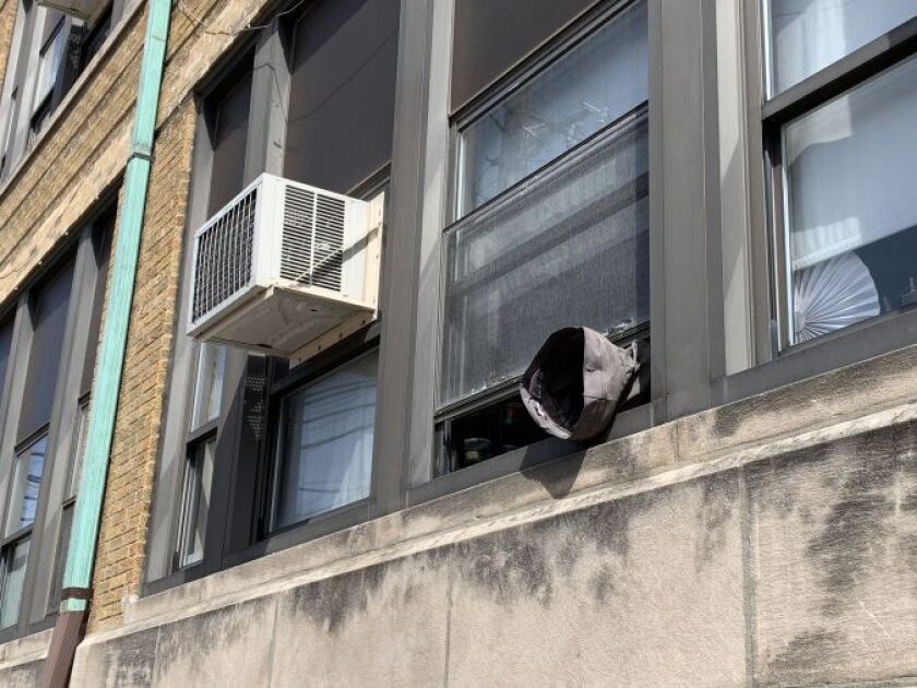A ventilation tube hangs out of a window at Camras Elemntary School on Wednesday. | Mitchell Armentrout/Sun-Times