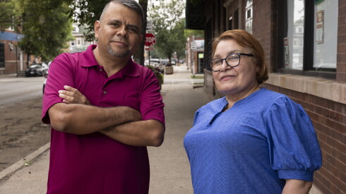 Juan Gama, vice president of the Street Vendors Association, and Maria Ochoa, treasurer, stand outside their headquarters.