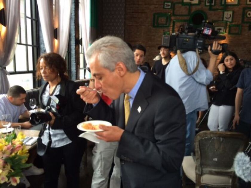 At a press conference earlier today, Mayor Rahm Emanuel samples some of the fare that will be featured at Taste of Chicago. | FRAN SPIELMAN PHOTO