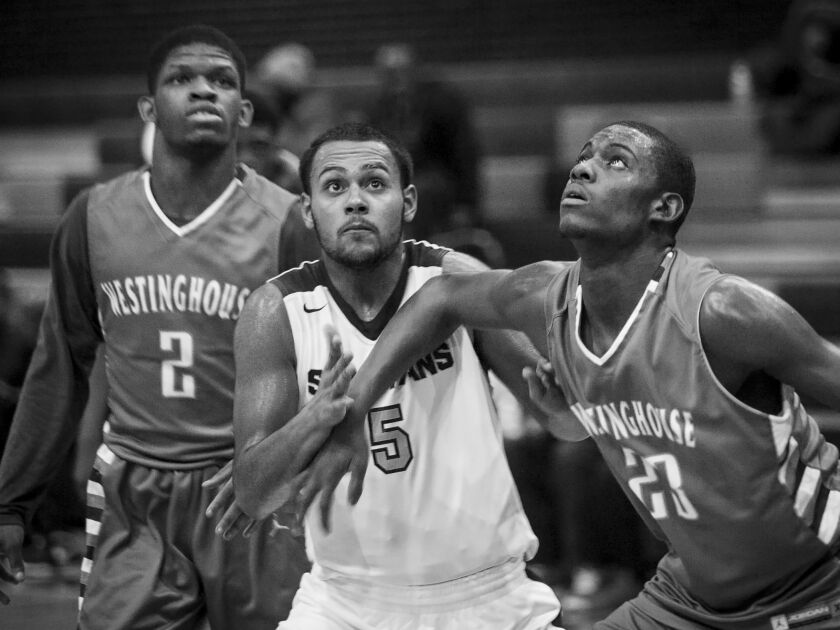 Brian Hernandez goes for a rebound against Westinghouse College Prep at Orr Academy High School, Jan. 11, 2017.