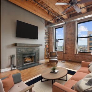 Living room with a wood-burning fireplace