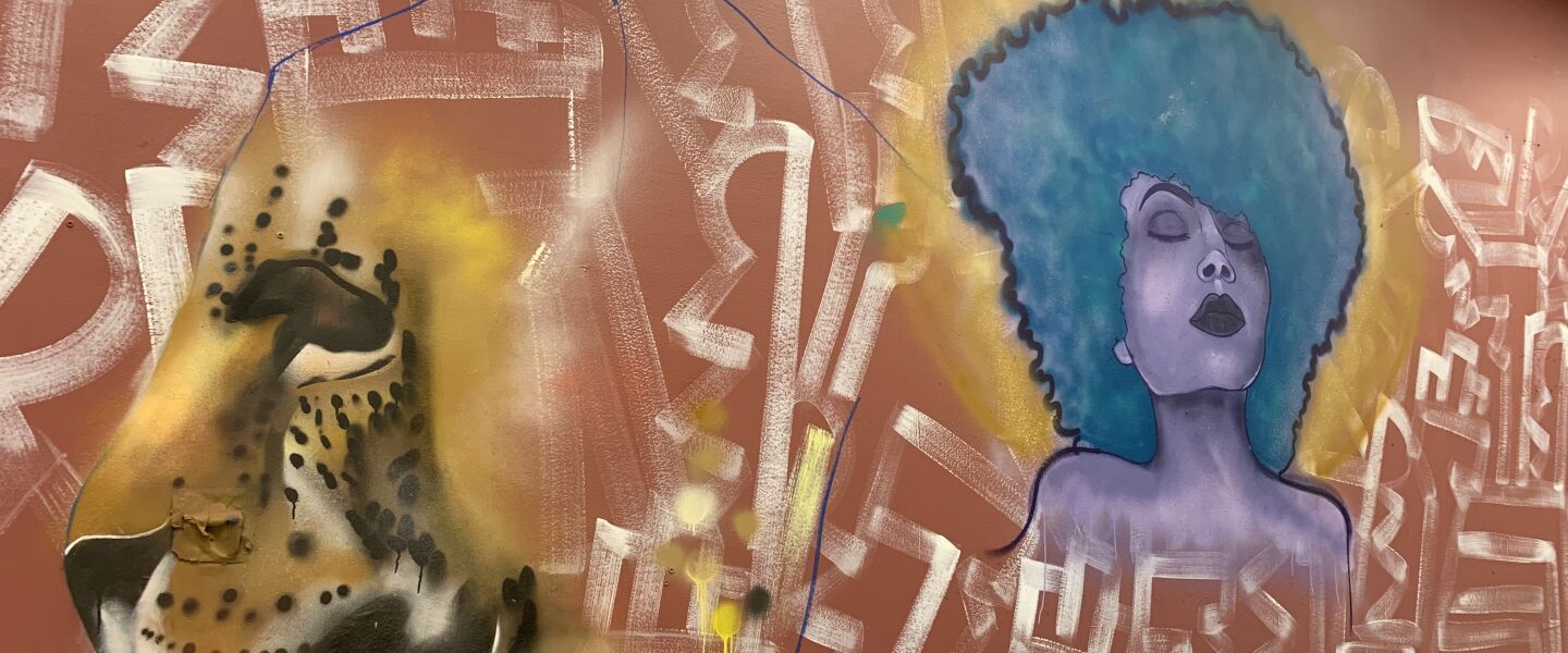 At Martin Luther King Jr. College Preparatory High School, there’s a new mural featuring a jaguar — the school’s mascot — and a person with large, blue hair.