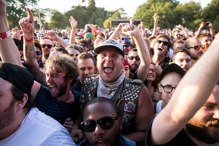 Fans cheer as The Lawrence Arms performs on day two of Riot Fest in Douglas Park, Sept. 16, 2017. | Ashlee Rezin/Sun-Times