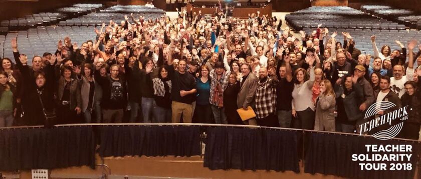 Teachers pose with Steve Van Zandt (front row center) during a stop on the rocker’s Teacher Solidarity Tour. | Teachrock.org