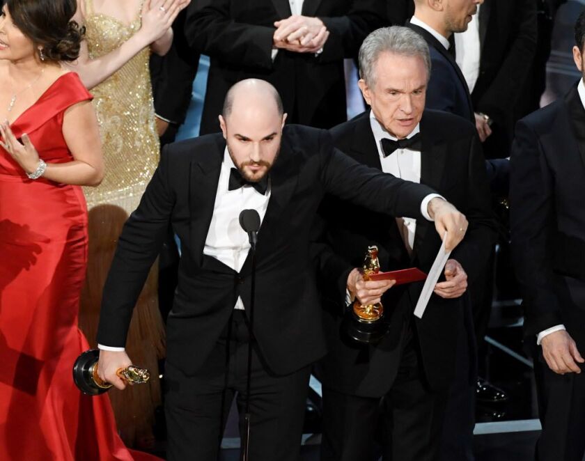 <strong>“La La Land’ producer Jordan Horowitz holds up the winner card reading actual best picture winner “Moonlight” with actor Warren Beatty onstage during the 89th Annual Academy Awards on February 26, 2017, in Hollywood, California. (Photo by Kevin W