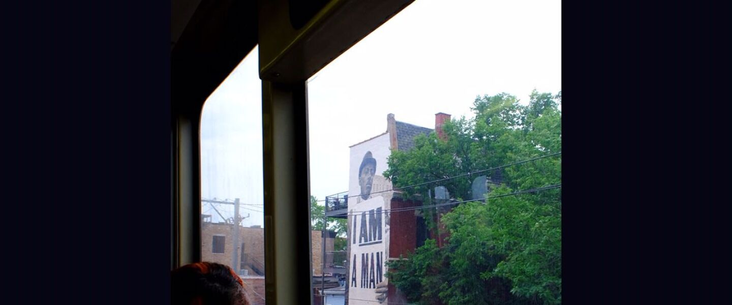 The “I AM A MAN” mural as seen from a CTA Blue Line L train in Wicker Park. The painting is based on a 1968 image of a man mourning at a memorial for the Rev. Martin Luther King Jr.