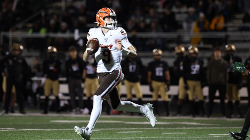 Hersey's Jake Nawrot (9) rolls out to attempt a pass during the Huskies' 42-14 victory over Richards last season.