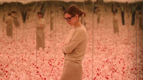 Assistant curator is reflected in a mirror as she talks about the art of Yayoi Kusama in a mirrored infinite room at Wrightwood 659 in Chicago, Illinois, U.S., September 23, 2026.