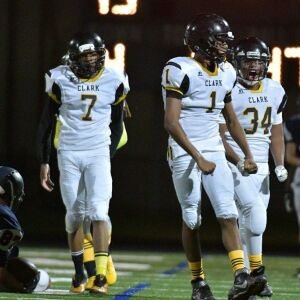 Clark’s Derrick Linzy (1) and Darrel Glover (34) celebrate. Worsom Robinson/For the Sun-Times.