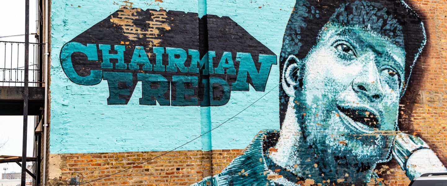 A 2010 mural of Fred Hampton that was painted over with a new painting remembering the slain Black Panthers leader.