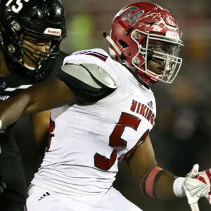 Homewood-Flossmoor’s Charlie Brooks (54) disrupts a play. Homewood-Flossmoor’s Dominick Jones (8) completes a pass. Allen Cunningham/For the Sun-Times.
