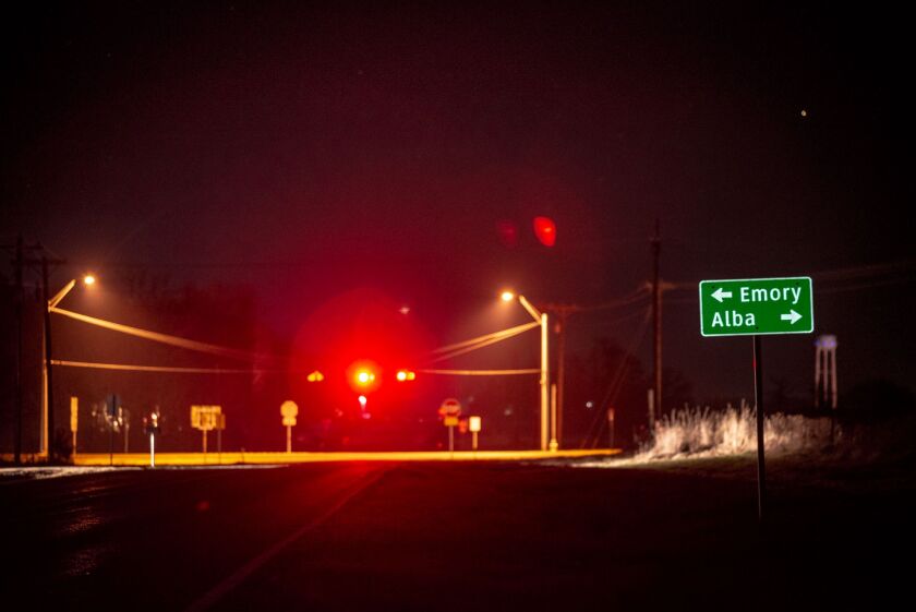 A road sign on Farm-to-Market Road 779 in Rains County, Texas, points to Emory, where the sheriff’s office is located, and Alba, where Palos Park obstetrician and gynecologist Dr. George Chronis was found dead on his remote property in May 2018.