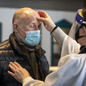 Robert Novickas, 70, of the South Loop, receives the imposition of ashes from the Rev. Amity Carrubba at Grace Episcopal Church of Chicago in the South Loop on Ash Wednesday, Feb. 17, 2021.