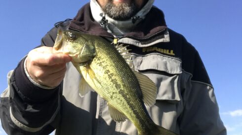 Ken “Husker” O’Malley with a largemouth bass from local waters. Provided photo