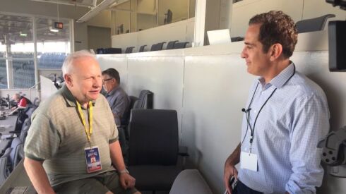 Longtime local reporter Craig Lynch (left) talks with NBC Sports Chicago’s Chuck Garfien in the Wrigley Field pressbox. Lynch died on Tuesday at the age of 72.