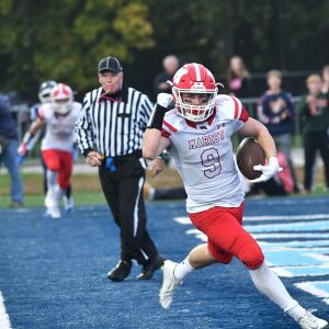 Marist’s Billy Skalitzky (9) trots in for a touchdown. Worsom Robinson/For the Sun-Times.