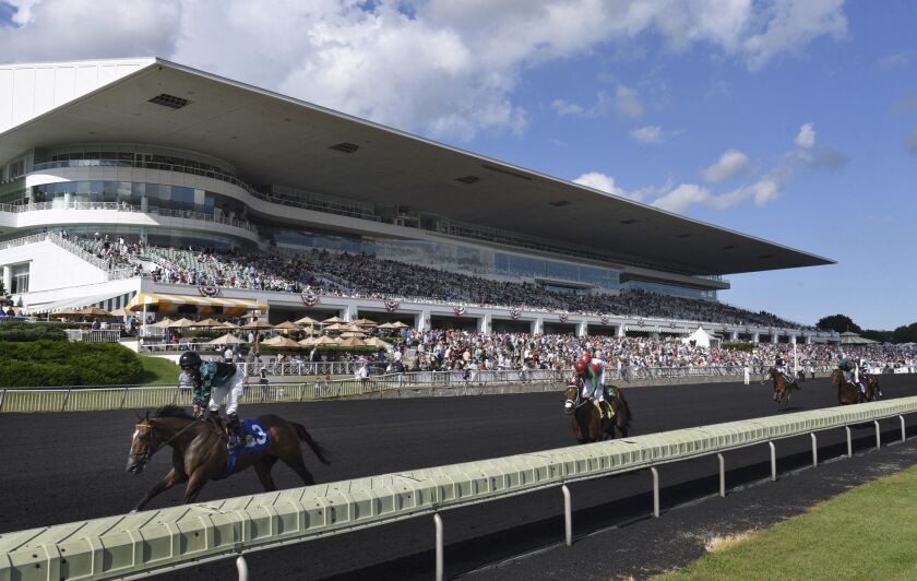 Horses in the Bruce D. Memorial Stakes pass the grandstand at Arlington International Racecourse in Arlington Heights in 2017.