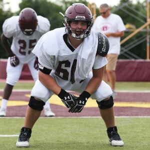 Loyola’s Peter Gianaris listens as audibles are called during practice.