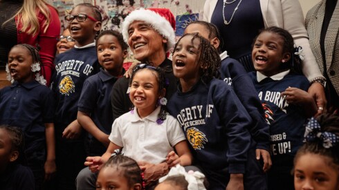 Former President Barack Obama poses with kids from Burke Elementary at the Bessie Coleman Chicago Public Library branch in Woodlawn on Tuesday.