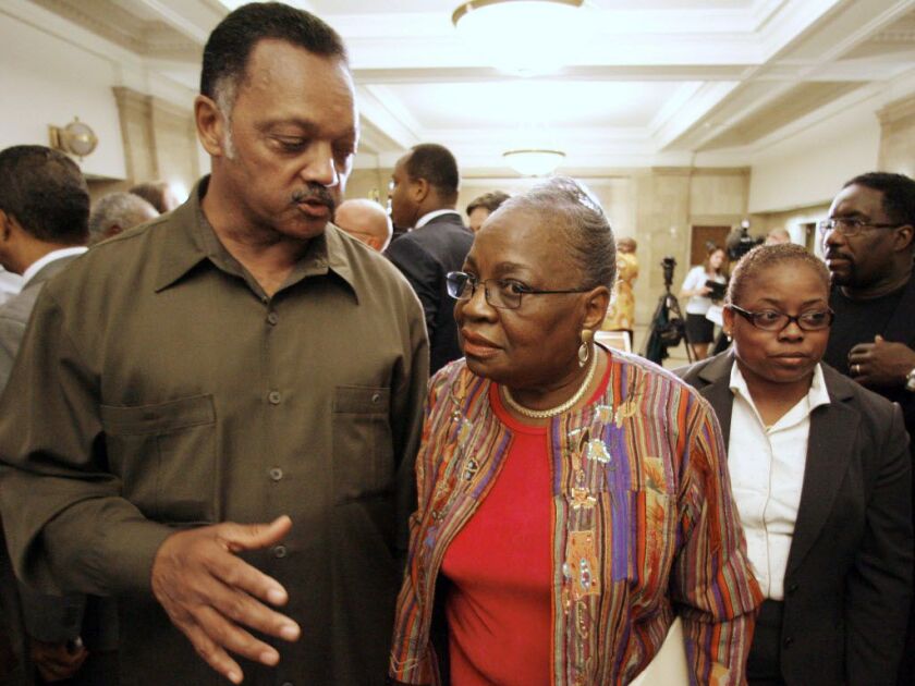 The Rev. Jesse Jackson Sr., talks with Cook County Commissioner Bobbie Steele after a news conference in Chicago Thursday, July 6, 2006. Jackson gave Steele his support in her bid to take over as interim board president when John Stroger retires. Stroger
