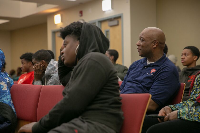 Corps Ministries Director Theo Coleman listens to the evening’s presentation, along with 100 youths who weekly attend the Wednesday night Celebrate Launch and Landing program at the Salvation Army Red Shield Center in Englewood. | Nader Issa/Sun-Times
