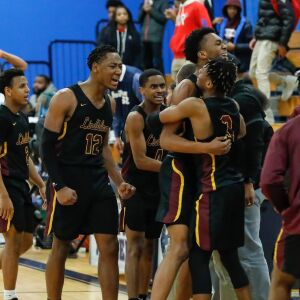 Lindblom players celebrate after winning the game against Hyde Park.