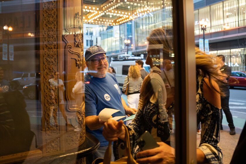 Richard Shavzin, an actor and director, hands out fliers about a possible strike by Actors’ Equity Association members on Broadway tours outside the James M. Nederlander Theatre in the Loop on the opening night of Jagged Little Pill, Wednesday, April 12. The group is fighting for increases in per diem and adequate job coverage in their next contract.