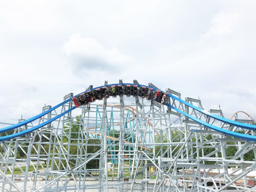 This image provided by Six Flags Over Georgia in Austell, Ga., shows the new Twisted Cyclone roller coaster. The hybrid roller coaster combines a traditional wood coaster structure with a steel track. | Six Flags via AP