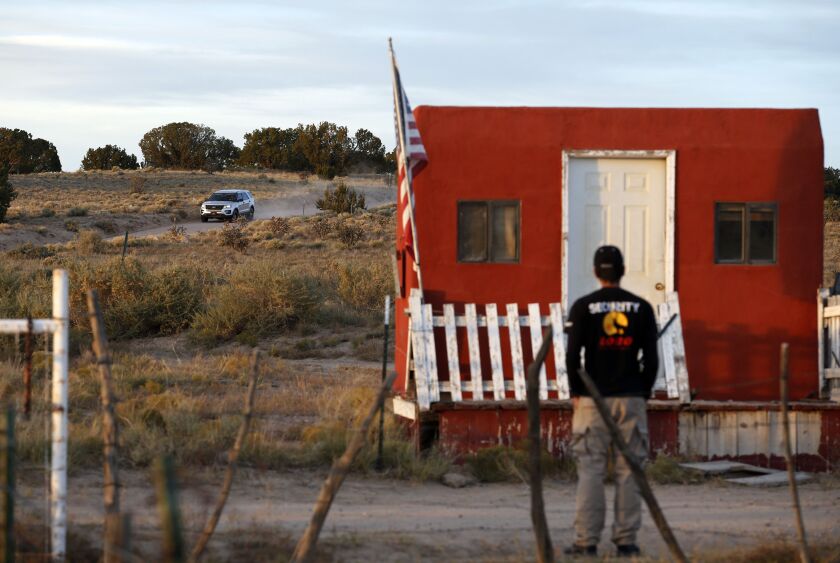A law enforcement vehicle leaves the Bonanza Creek Film Ranch in Santa Fe, N.M. on Friday, Oct. 22, 2021. The movie “Rust” was being shot at the ranch on Thursday when actor Alec Baldwin fired a prop gun on the set, killing the cinematographer, officials said. The director of the movie was wounded.