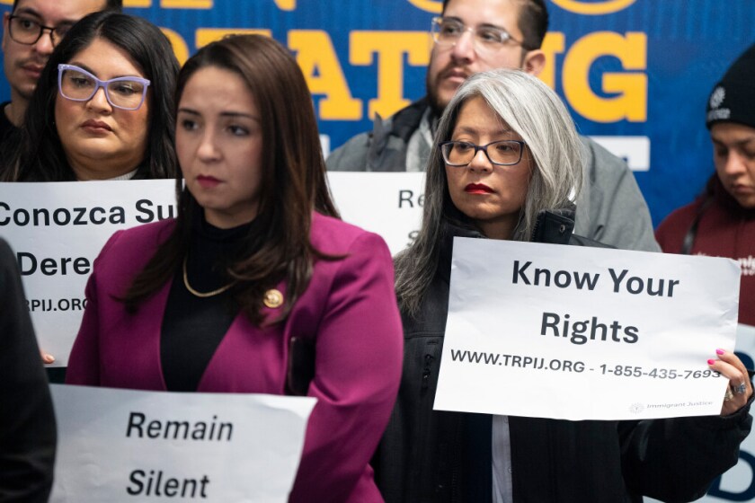 Ald. Leni Manaa-Hoppenworth (48th) holds a sign that reads, “Know Your Rights” during a news conference in Pilsen, Saturday, Jan. 18, 2025, where advocates and elected officials discussed how undocumented immigrants can protect themselves from deportation ahead of the incoming Trump administration.