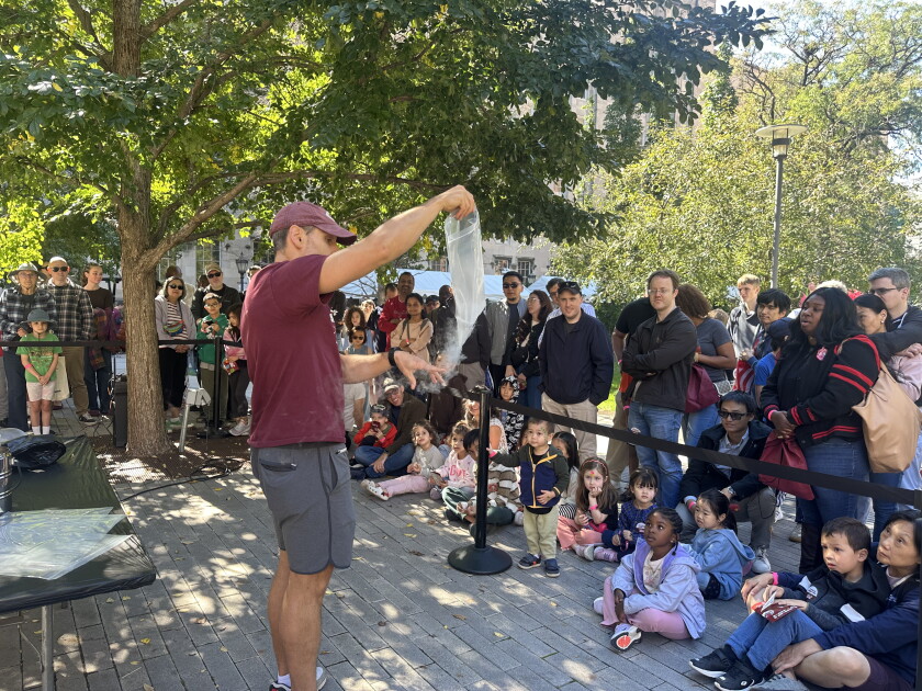 Attendees of the fifth annual South Side Science Festival watch a nitrogen oxide demonstration in awe at the University of Chicago on Saturday, Oct. 3, 2026.