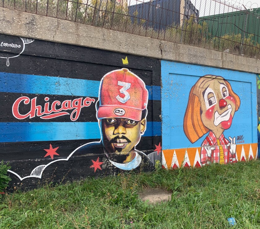 The mural at left, by 41-year-old Clearing artist Milt Coronado, features Chance the Rapper. “I’m a fan of his music” and “a fan of what he does for the community,” Coronado says. The mural at right, by 47-year-old Morton Grove artist Dale Paracuelles, features Cooky the clown from the old “Bozo’s Circus” show on WGN-TV. Paracuelles, who goes by Deal for his art, says he grew up watching the iconic Chicago show.